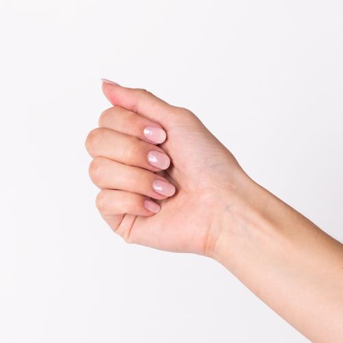 Hand with Livin' La Vida Yoga painted on nails