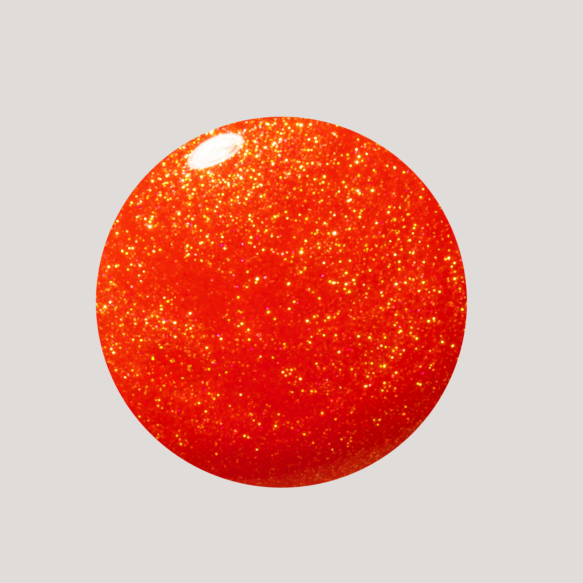 Red glittery sphere on a light gray background