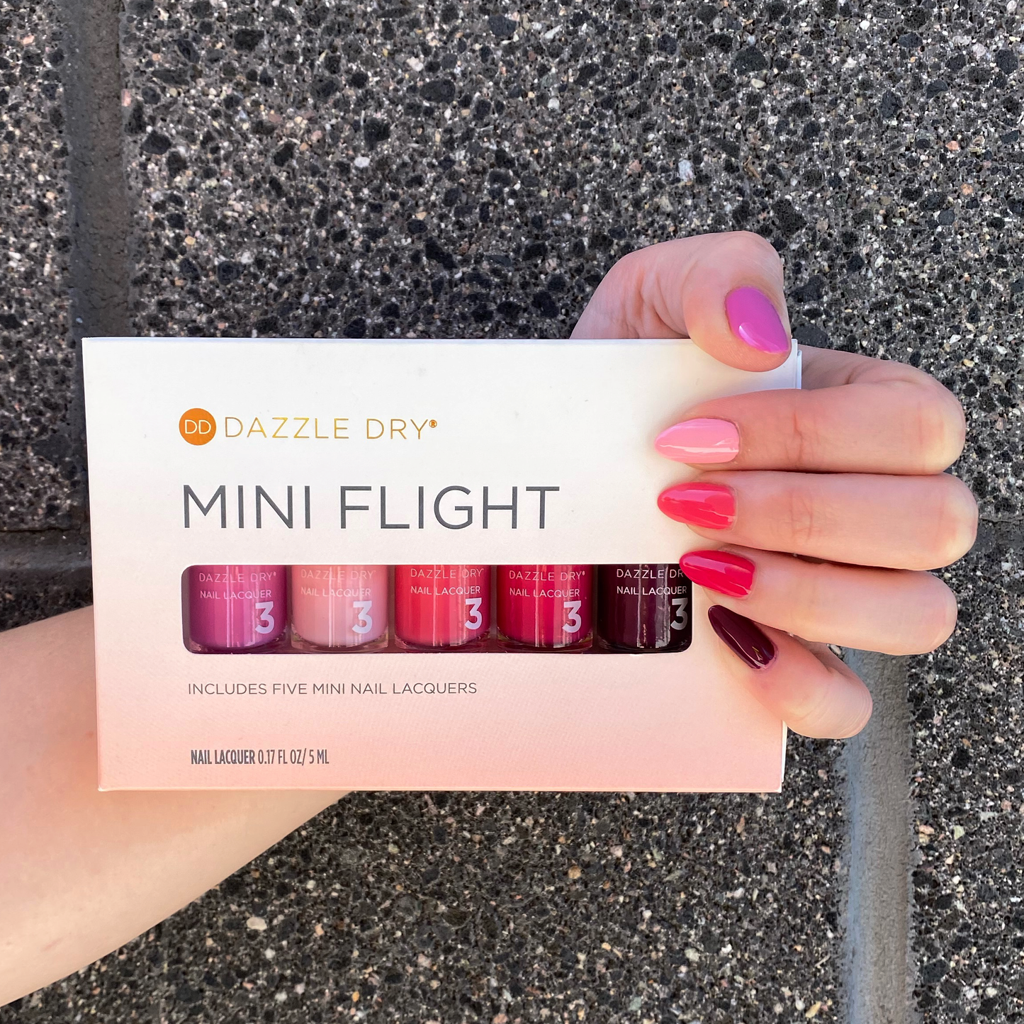 Hand with Coronado Mini Flight painted on nails holding Coronado Mini Flight
