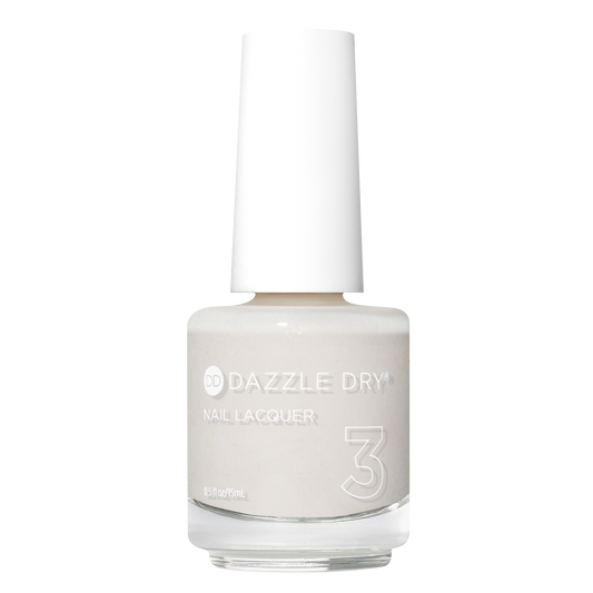 A bottle of Dazzle Dry Nail Lacquer in shade 3, featuring a light warm off-white color with a white cap, shown on a solid white background.