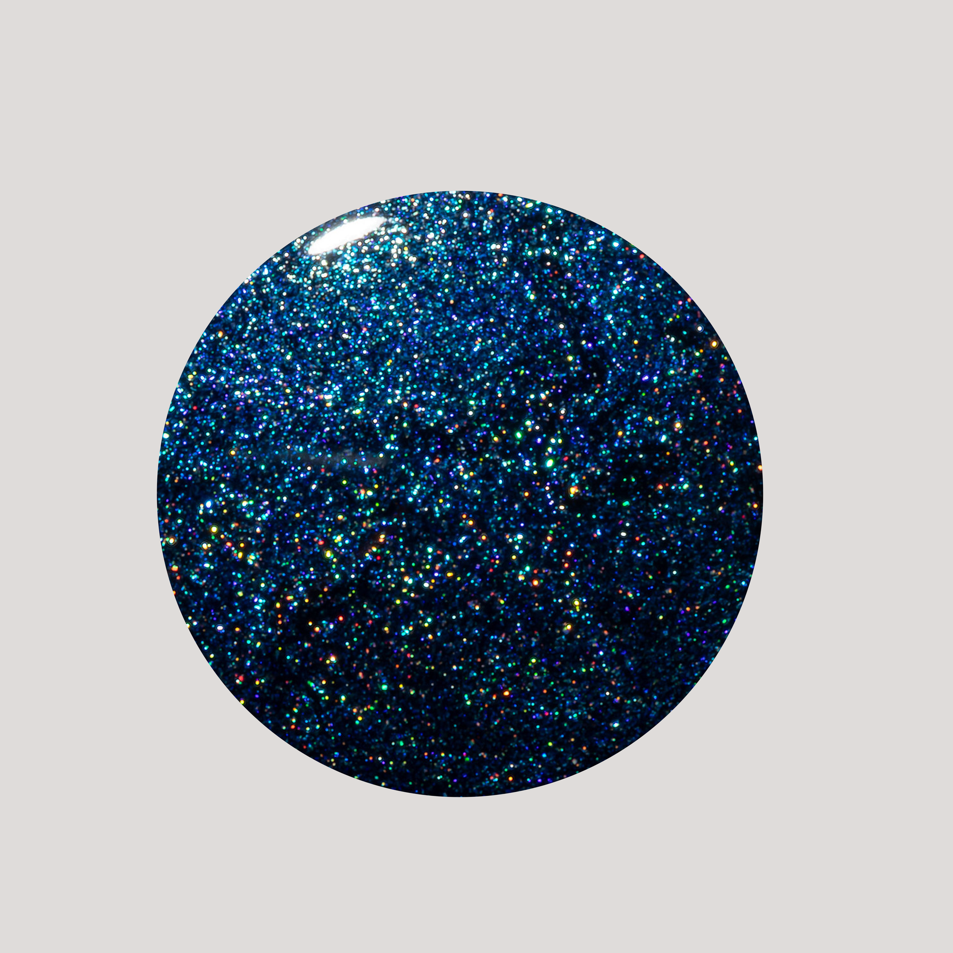 Round blue glittery object on a gray background