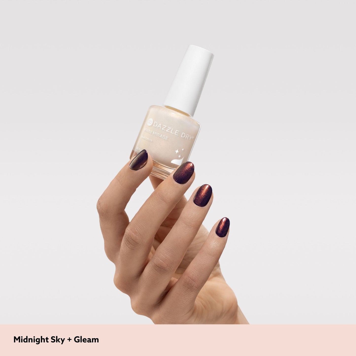 hand holding nail polish bottle 