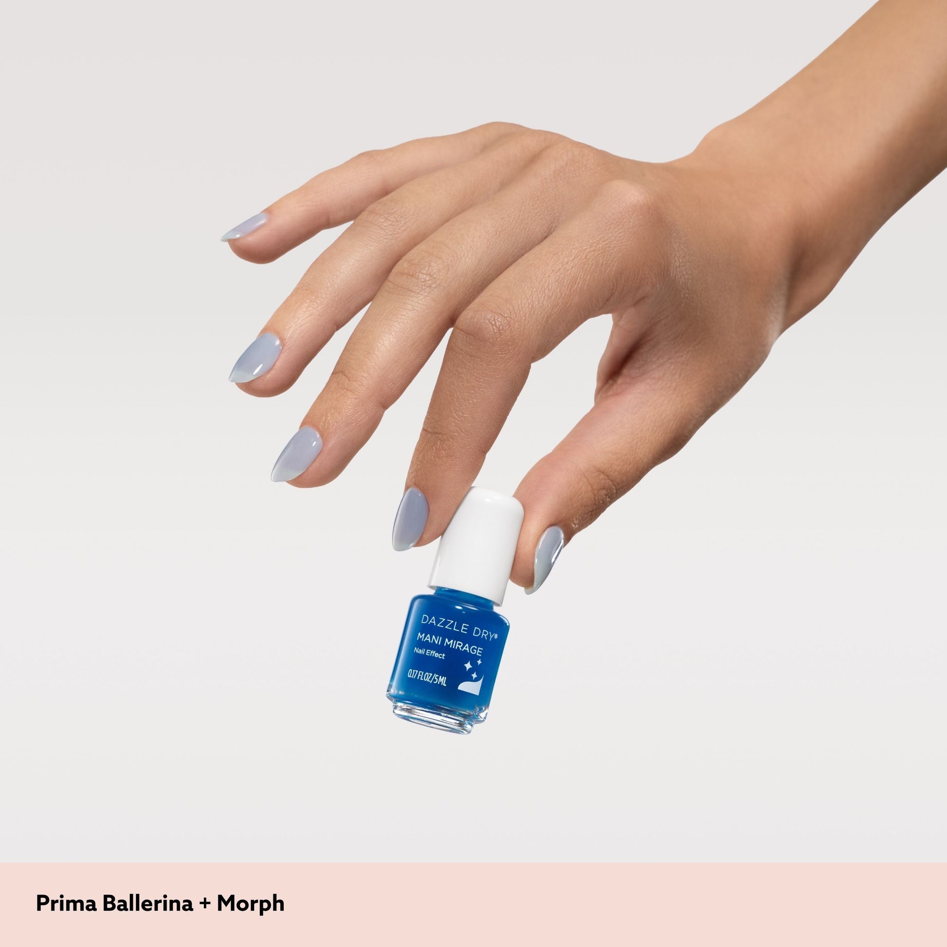 hand holding mini nail polish bottle blue