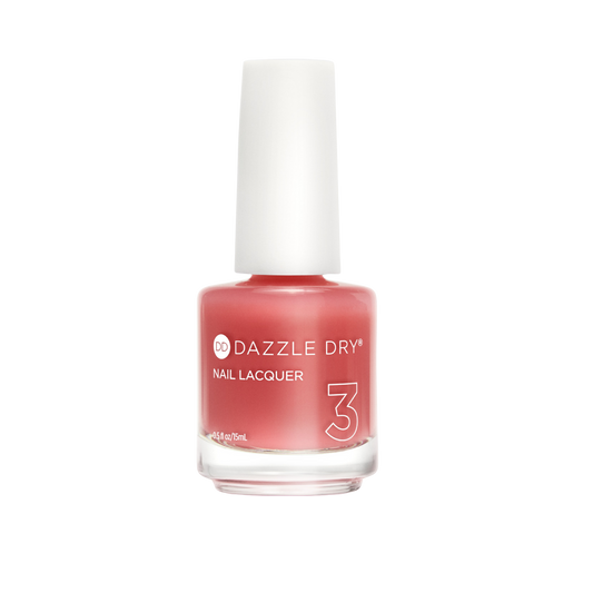 A bottle of Dazzle Dry Nail Lacquer in shade 3, featuring a coral pink lacquer visible through a clear glass bottle with a white cap, set against a plain white background.