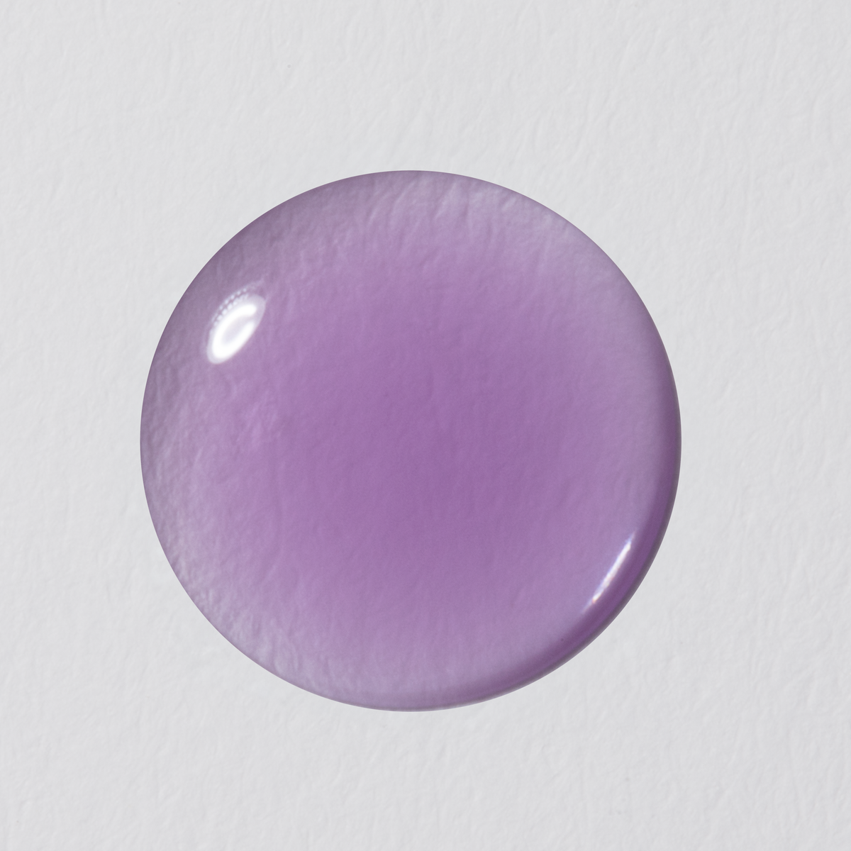 Round purple object on a light gray background