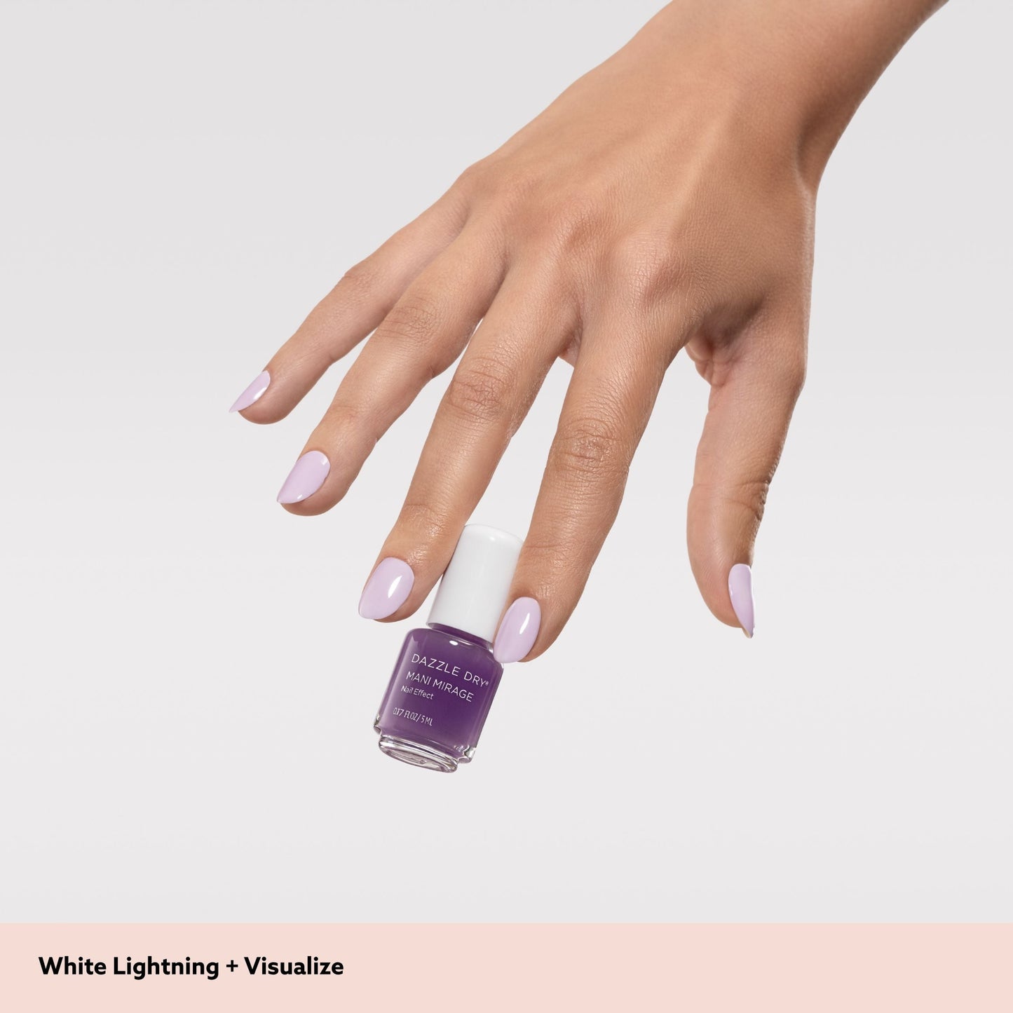 hand holding mini nail polish bottle
